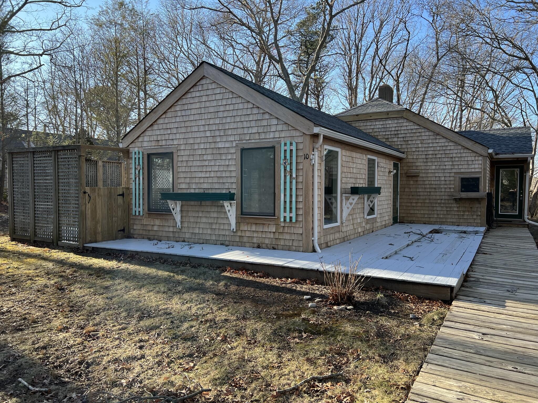 10 Freedom Road, Unit 10 Forestdale, MA 02644 - Photo 4 of 27 a view of a house with backyard and wooden fence