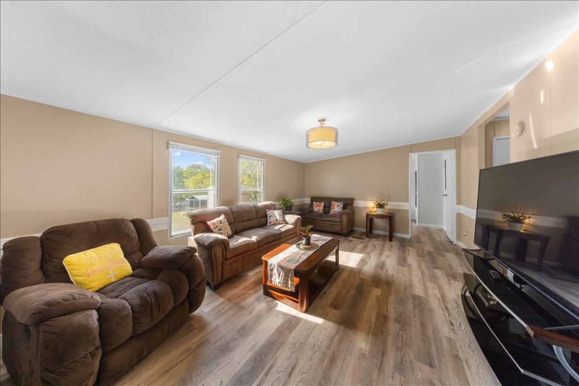 114 Dove Lane Kyle, TX 78640 - Photo 13 of 24 a living room with furniture and a flat screen tv