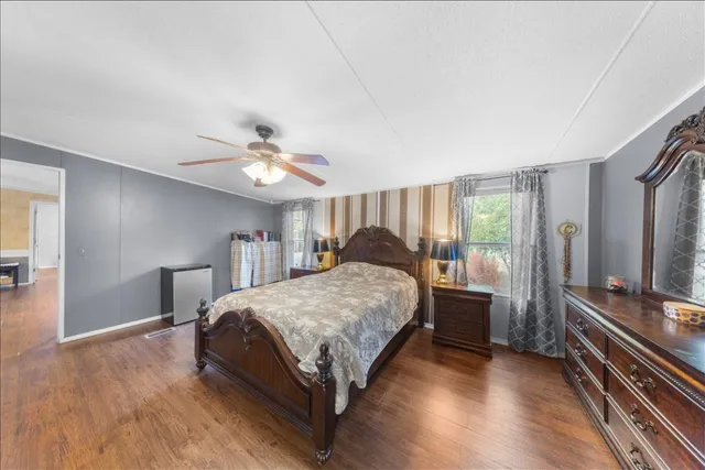 a bed room with a bed and a chandelier