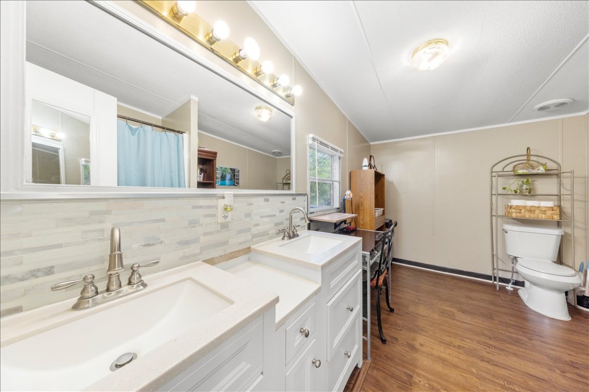 114 Dove Lane Kyle, TX 78640 - Photo 18 of 24 a bathroom with a sink and a mirror