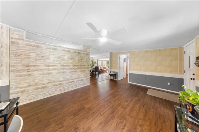 a view of a livingroom with wooden floor