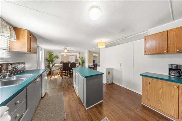 a kitchen with stainless steel appliances granite countertop a stove and a sink