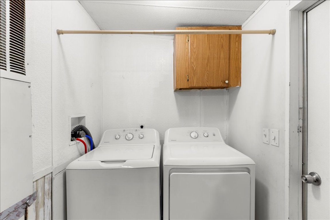 114 Dove Lane Kyle, TX 78640 - Photo 9 of 24 a utility room with dryer and washer