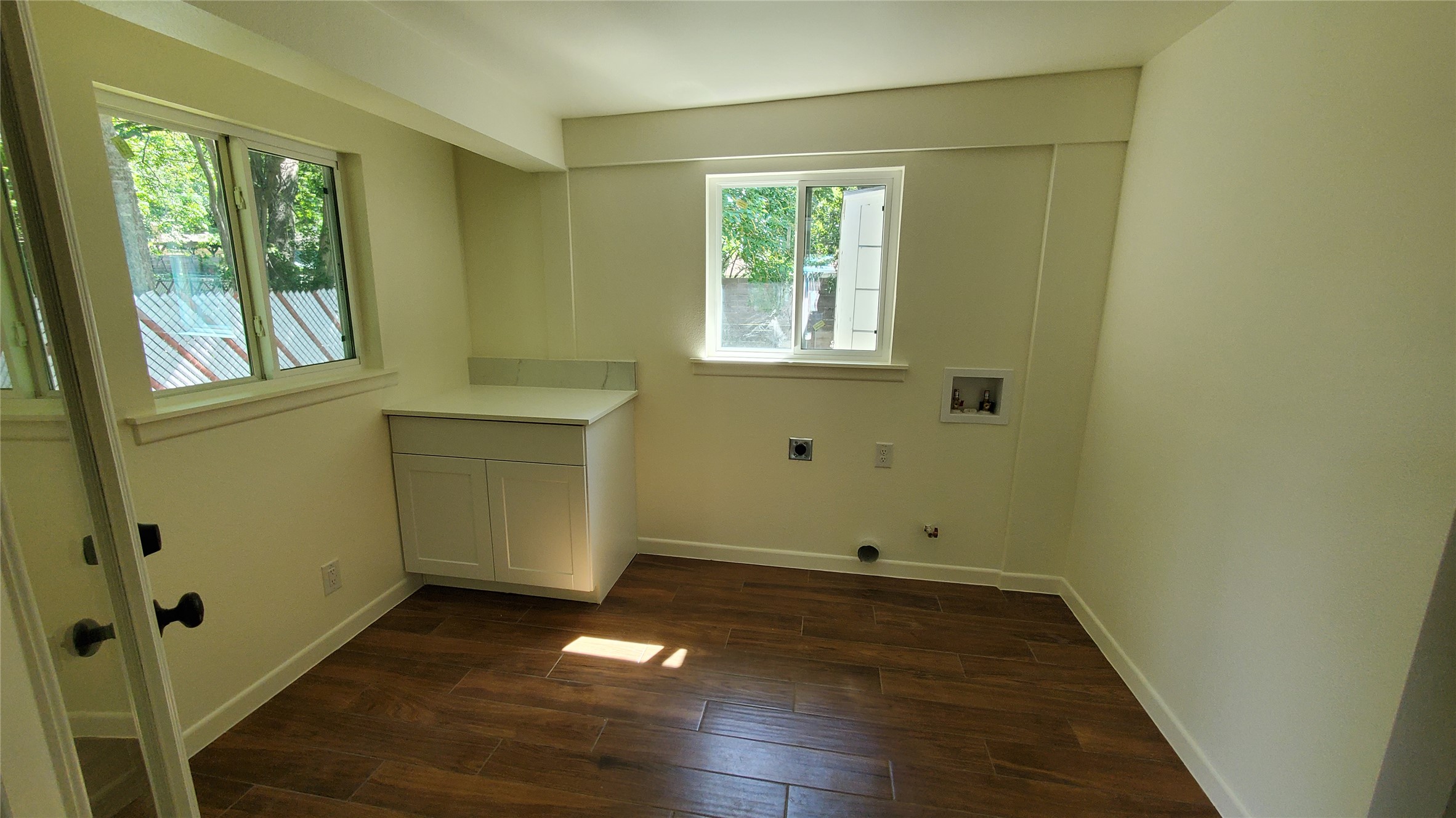 1601 East 19th Street Georgetown, TX 78626 - Photo 25 of 33 Ample windows illuminate this utility space with convenient counter and cabinet storage. Added in 2026