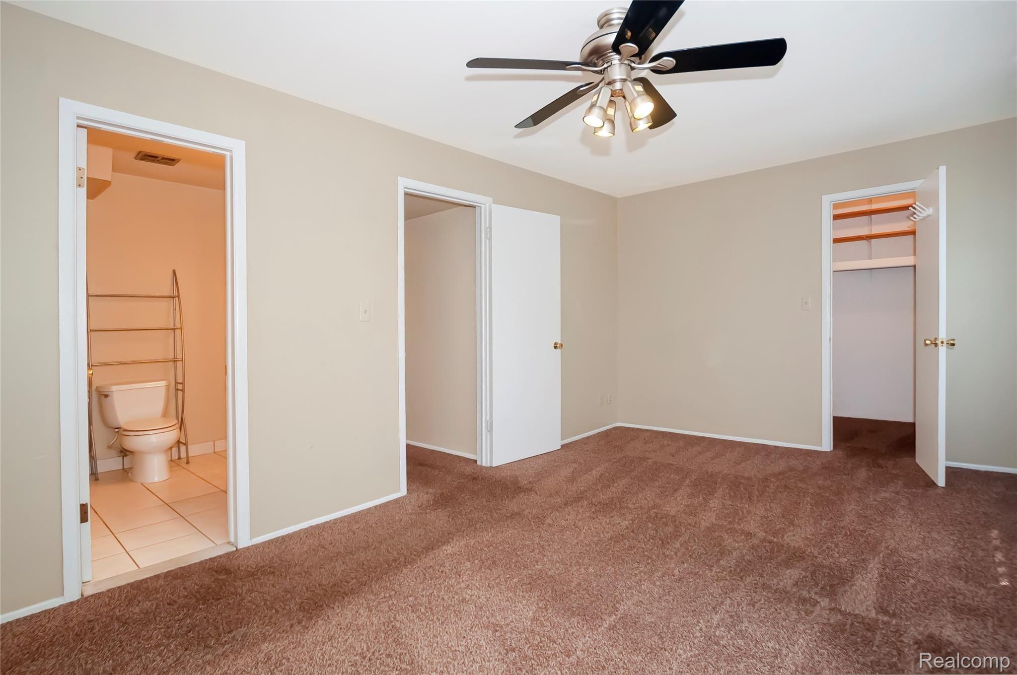 529 East University Drive, Unit 1201 Rochester, MI 48307 - Photo 17 of 24 Very large primary bedroom with bathroom access.