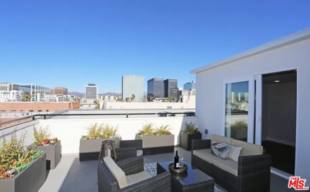 a view of roof deck with patio