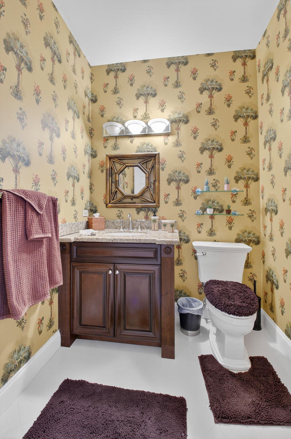 2423 Northwest 63rd Street Boca Raton, FL 33496 - Photo 12 of 83 a bathroom with a sink a toilet and a mirror