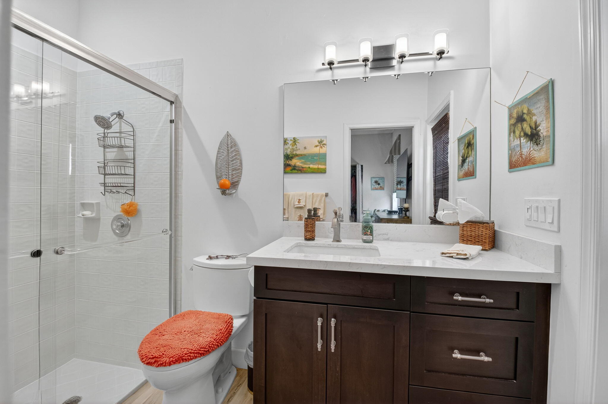 2423 Northwest 63rd Street Boca Raton, FL 33496 - Photo 20 of 83 a bathroom with a sink a toilet and shower
