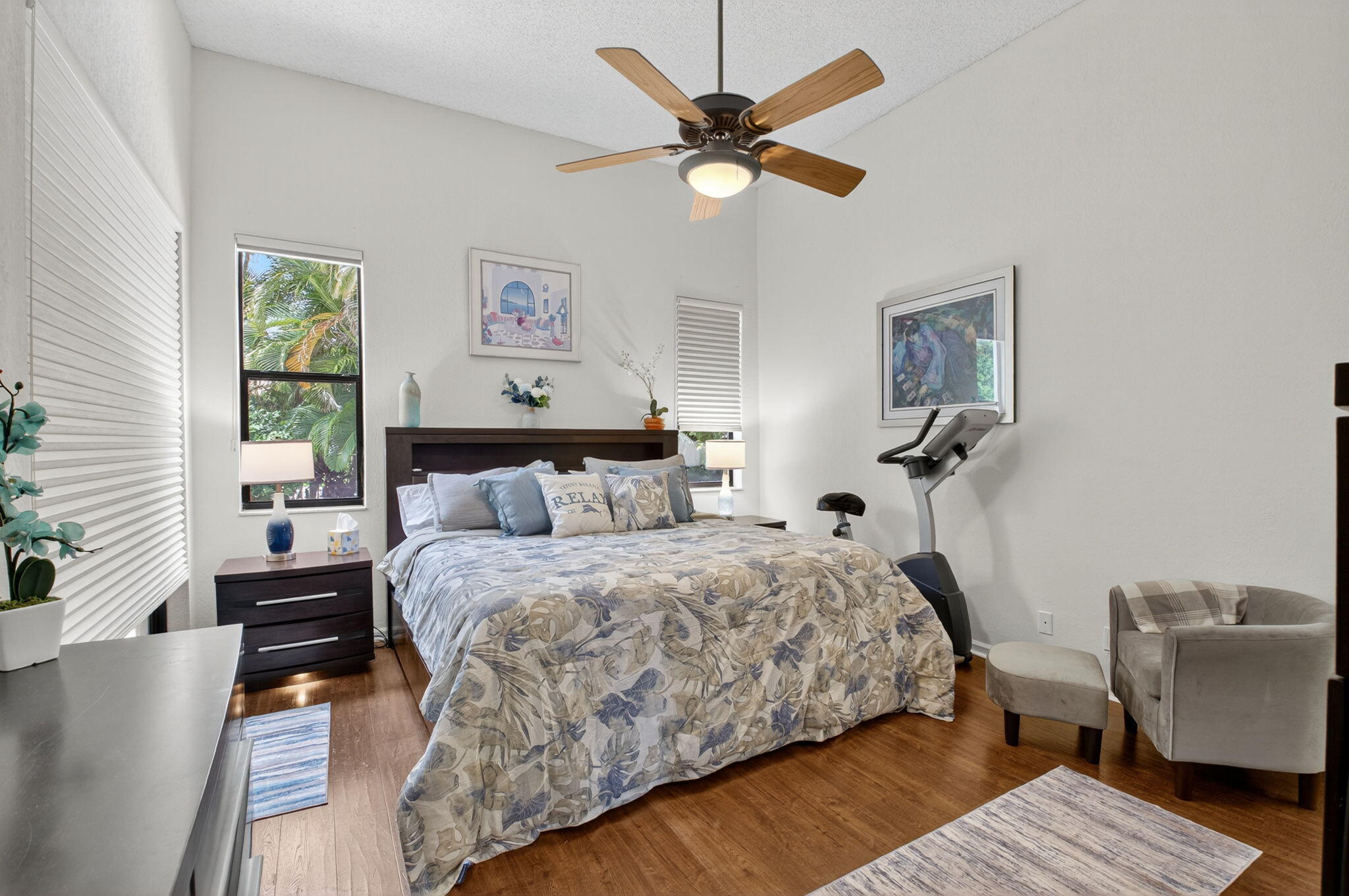 2423 Northwest 63rd Street Boca Raton, FL 33496 - Photo 23 of 83 a bedroom with a bed wooden floor and a window