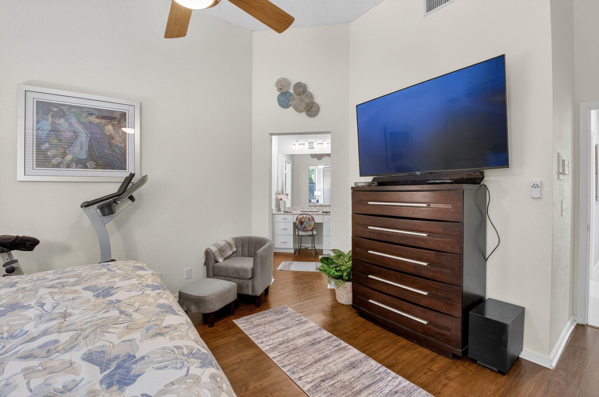 2423 Northwest 63rd Street Boca Raton, FL 33496 - Photo 24 of 83 a bedroom with a bed and a flat screen tv