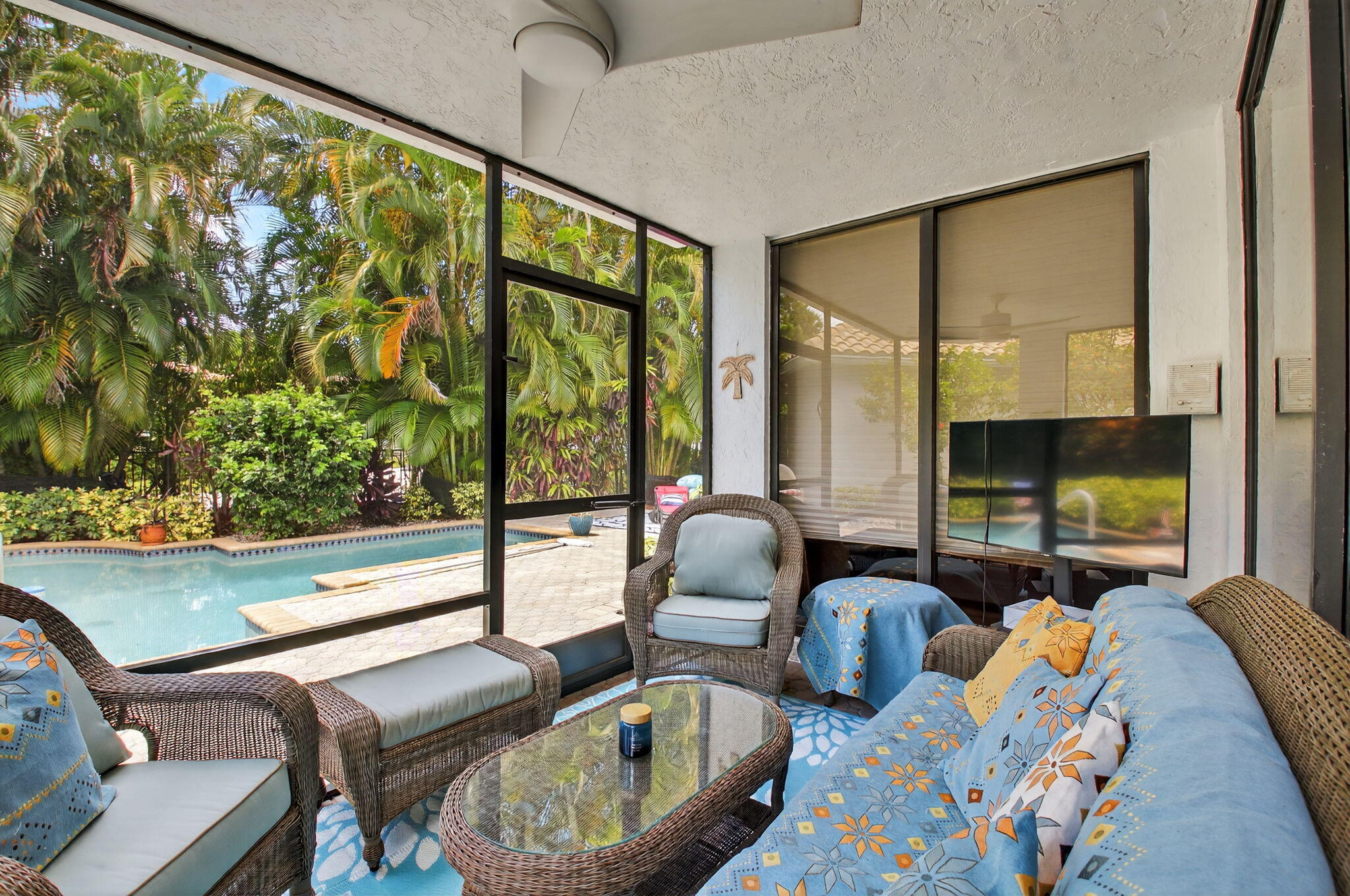 2423 Northwest 63rd Street Boca Raton, FL 33496 - Photo 28 of 83 a room with furniture and a flat screen tv