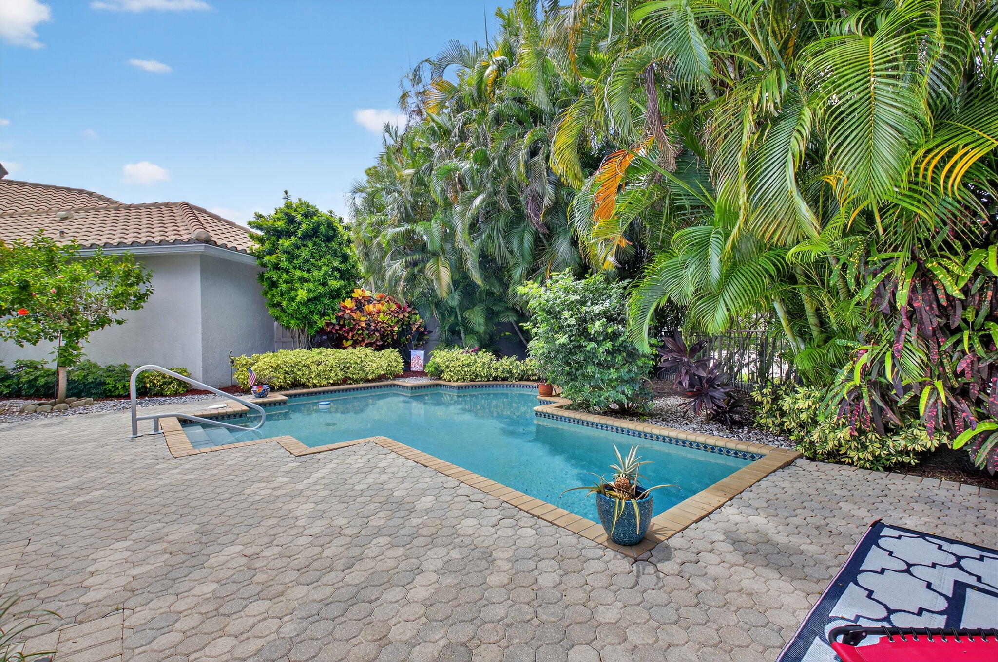 2423 Northwest 63rd Street Boca Raton, FL 33496 - Photo 34 of 83 a view of a backyard with plants and outdoor seating