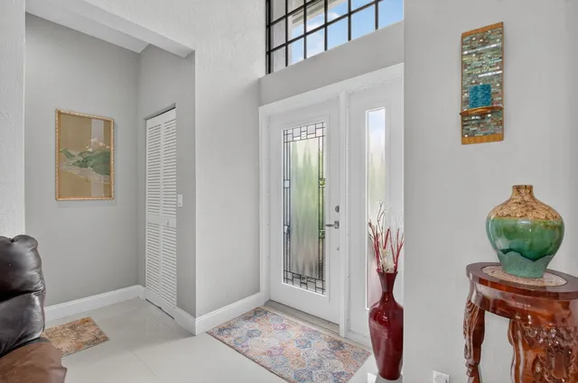 a living room with furniture ceiling fan and a rug