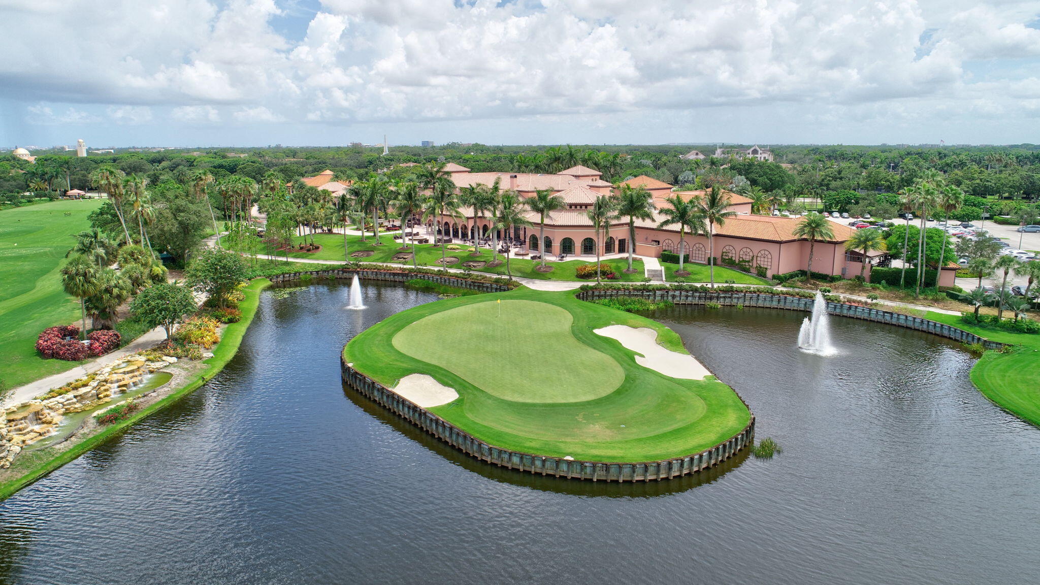 2423 Northwest 63rd Street Boca Raton, FL 33496 - Photo 67 of 83 a view of a swimming pool with a garden