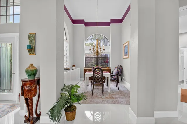 a kitchen with stainless steel appliances white cabinets and a stove top oven