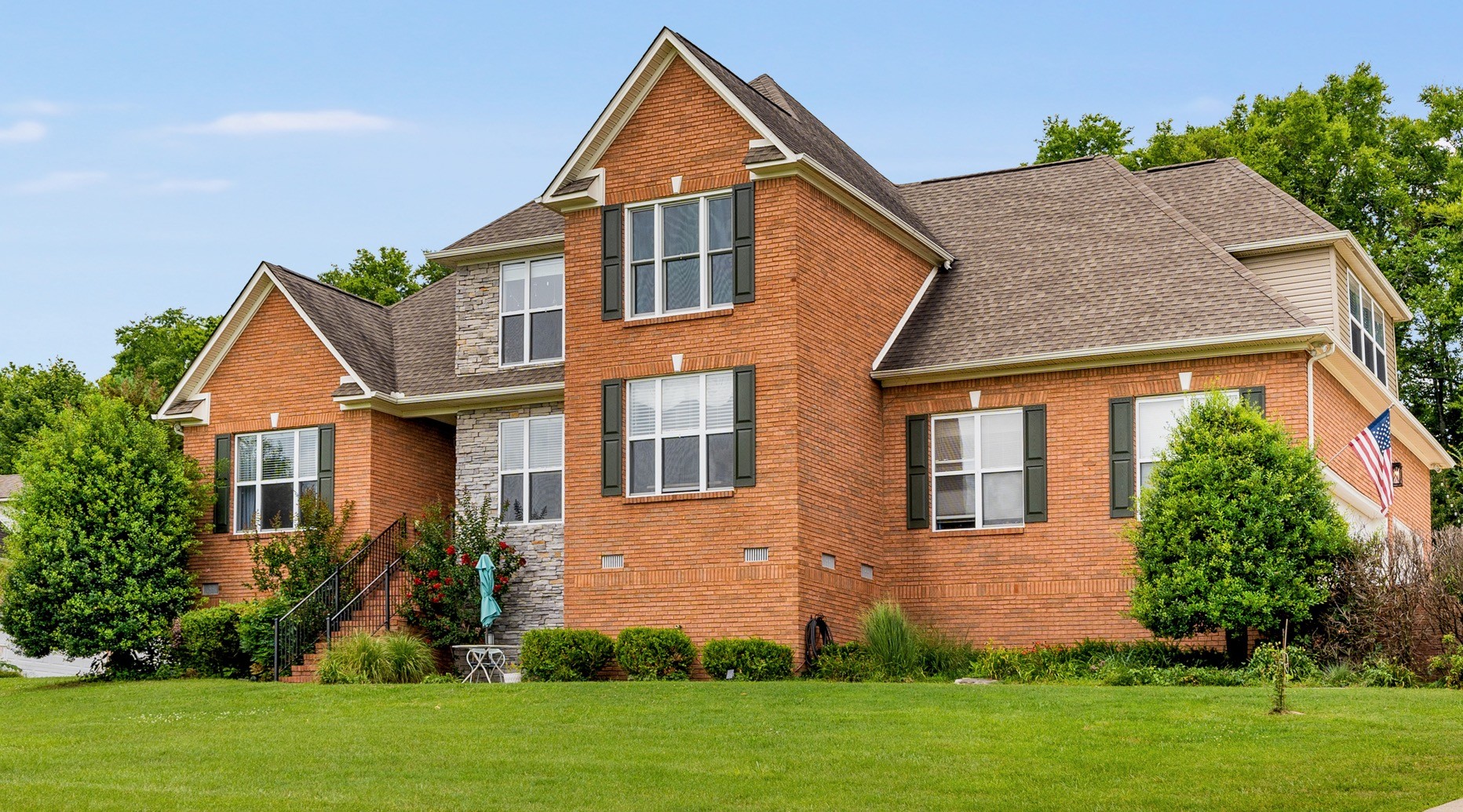 front view of a house with a yard