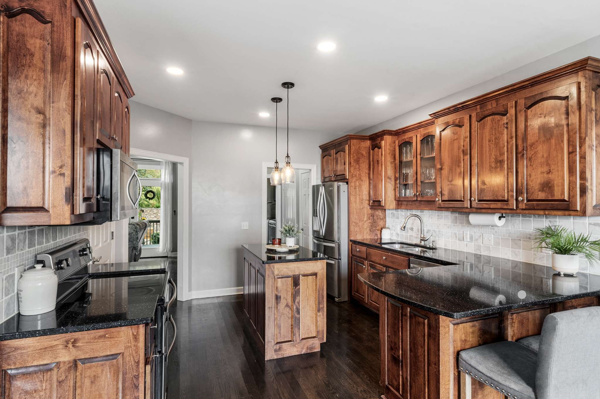 3029 Viewpointe Way Columbia, TN 38401 - Photo 11 of 29 a kitchen with stainless steel appliances granite countertop a sink stove and cabinets