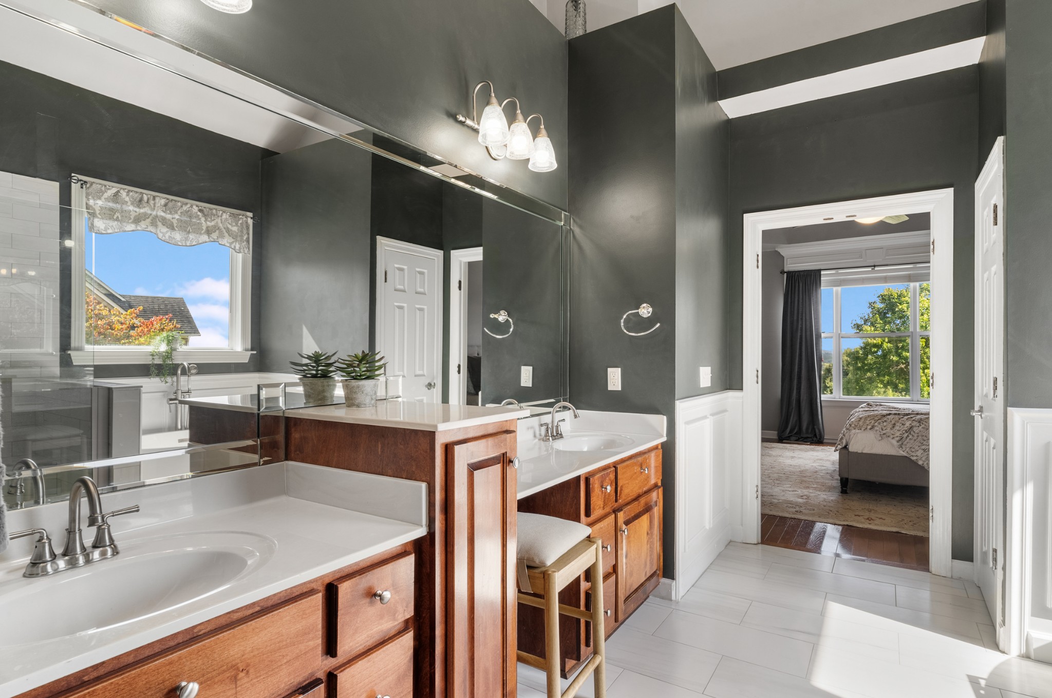 3029 Viewpointe Way Columbia, TN 38401 - Photo 13 of 29 a large bathroom with a double vanity sink a mirror and a bathtub