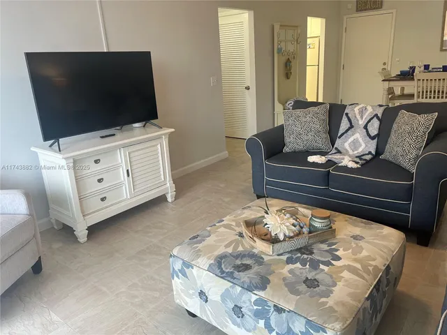 a bedroom with a bed and a night stand