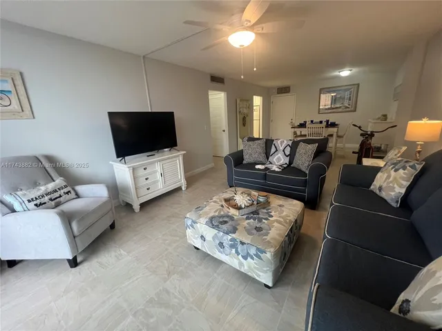 a living room with a couch and a flat screen tv