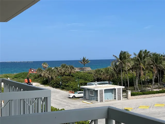 a bed sitting in a bedroom with a lamp