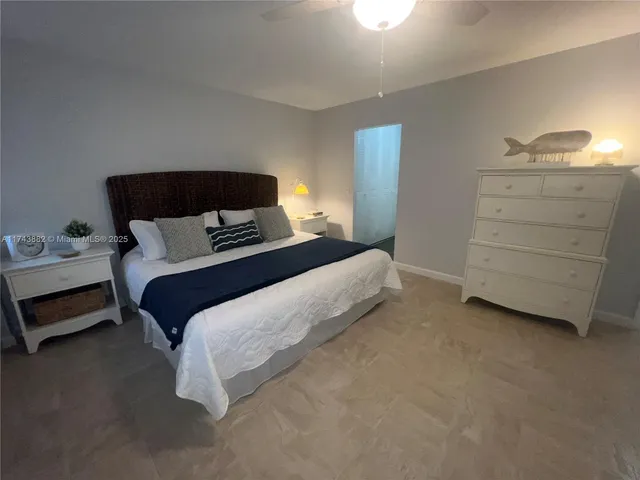 a view of a patio with a table and chairs