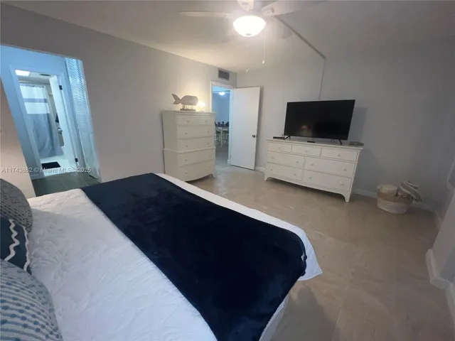 a view of a house with pool and sitting area