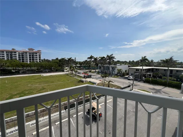 a dining room with furniture and a window