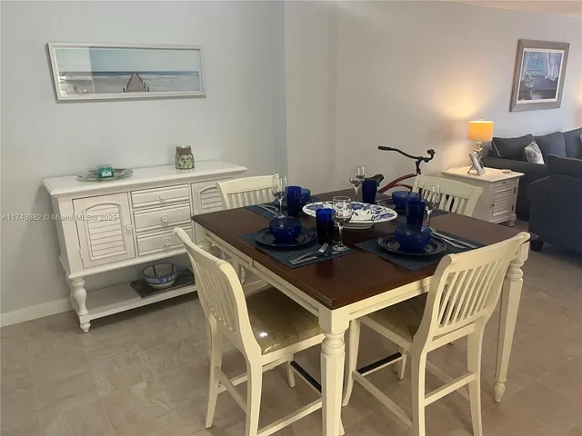 a living room with furniture and a lamp