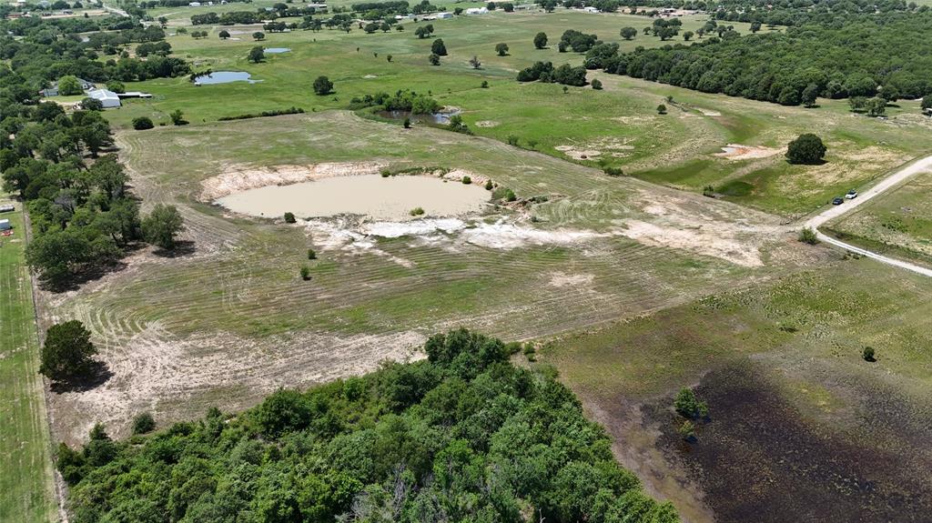 8605 West Highway 199 Springtown, TX 76082 - Photo 3 of 23 Expansive land parcel featuring multiple ponds and scattered mature trees