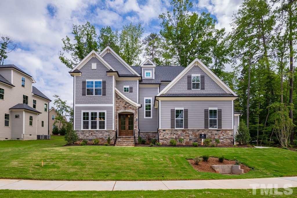 8000 Ghost Pony Trail Raleigh, NC 27613 - Photo 1 of 30 a front view of a house with a yard