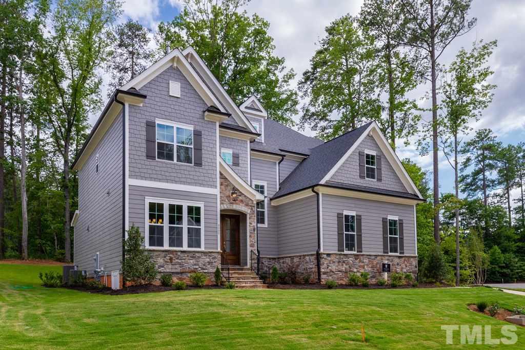 8000 Ghost Pony Trail Raleigh, NC 27613 - Photo 2 of 30 a front view of house with yard and green space