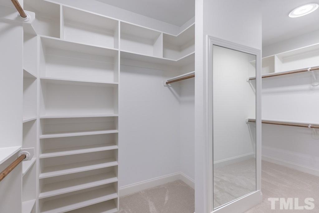 8000 Ghost Pony Trail Raleigh, NC 27613 - Photo 13 of 30 a view of walk in closet with empty racks