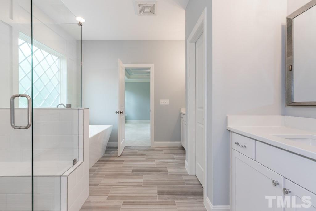 8000 Ghost Pony Trail Raleigh, NC 27613 - Photo 15 of 30 a view of a bathroom from the hallway