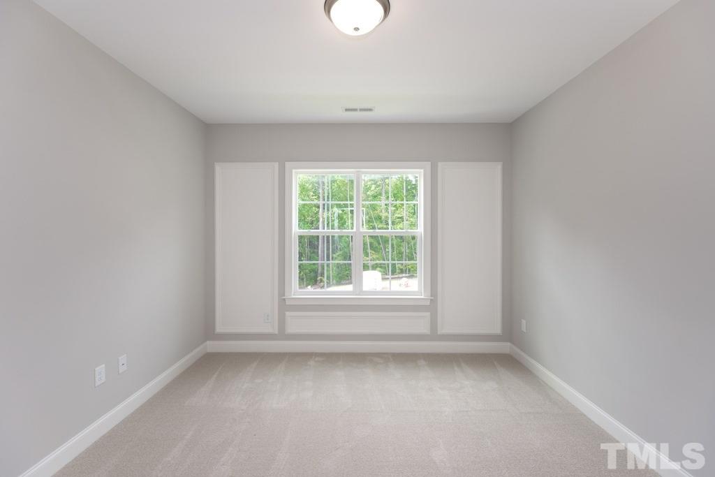 8000 Ghost Pony Trail Raleigh, NC 27613 - Photo 19 of 30 an empty room with a window