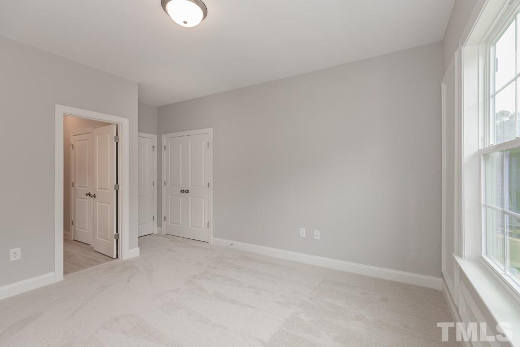 8000 Ghost Pony Trail Raleigh, NC 27613 - Photo 21 of 30 a view of an empty room with a window