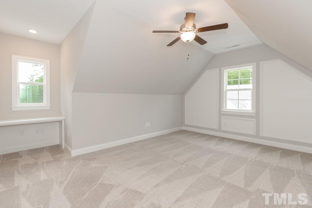 8000 Ghost Pony Trail Raleigh, NC 27613 - Photo 23 of 30 wooden floor in an empty room with a window
