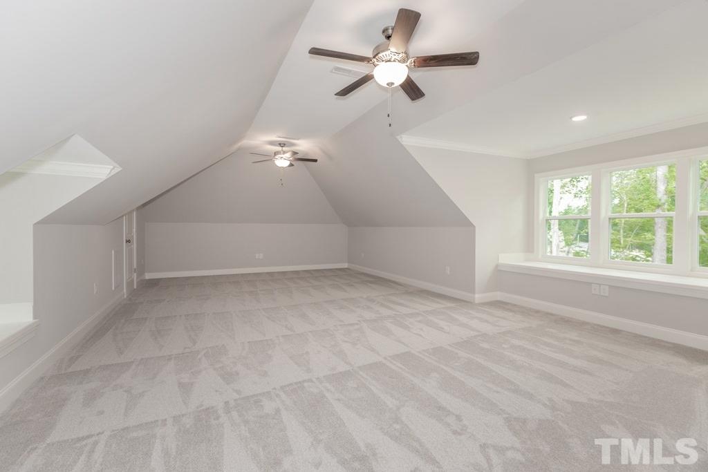 8000 Ghost Pony Trail Raleigh, NC 27613 - Photo 25 of 30 en empty room with windows and ceiling fan