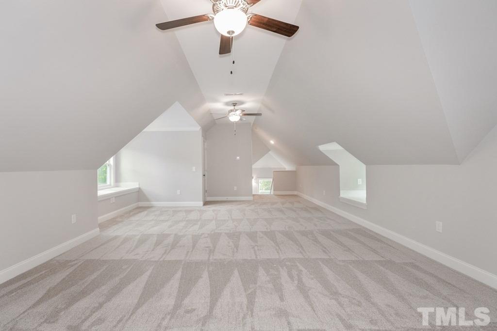 8000 Ghost Pony Trail Raleigh, NC 27613 - Photo 26 of 30 en empty room with windows and ceiling fan