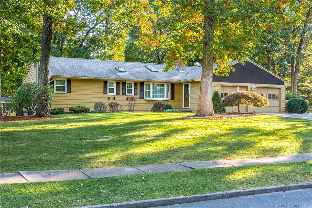 224 Redwood Road Manchester, CT 06040 - Photo 1 of 1 a front view of a house with a yard table and chairs