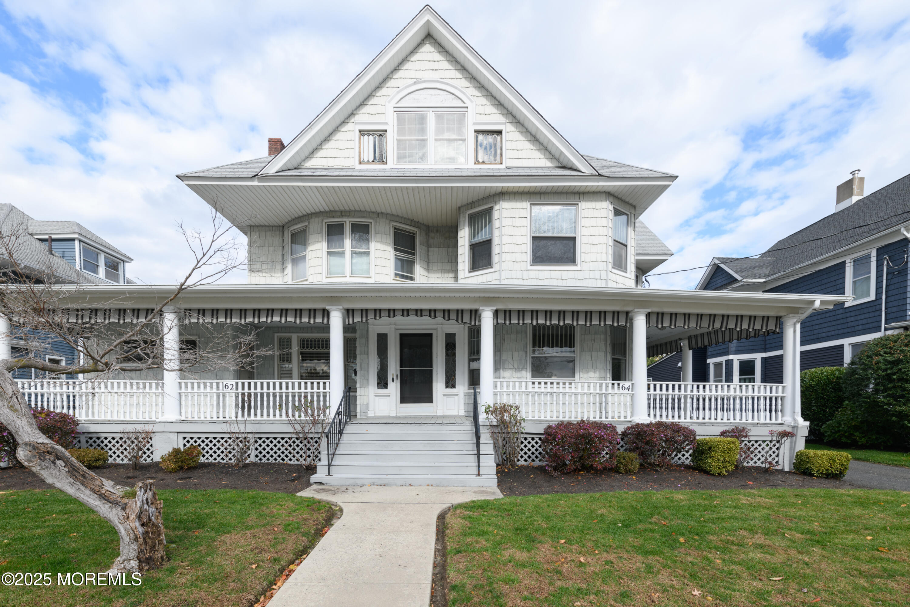 64 Harding Road Red Bank, NJ 07701 - Photo 1 of 23 a front view of a house with a yard and potted plants
