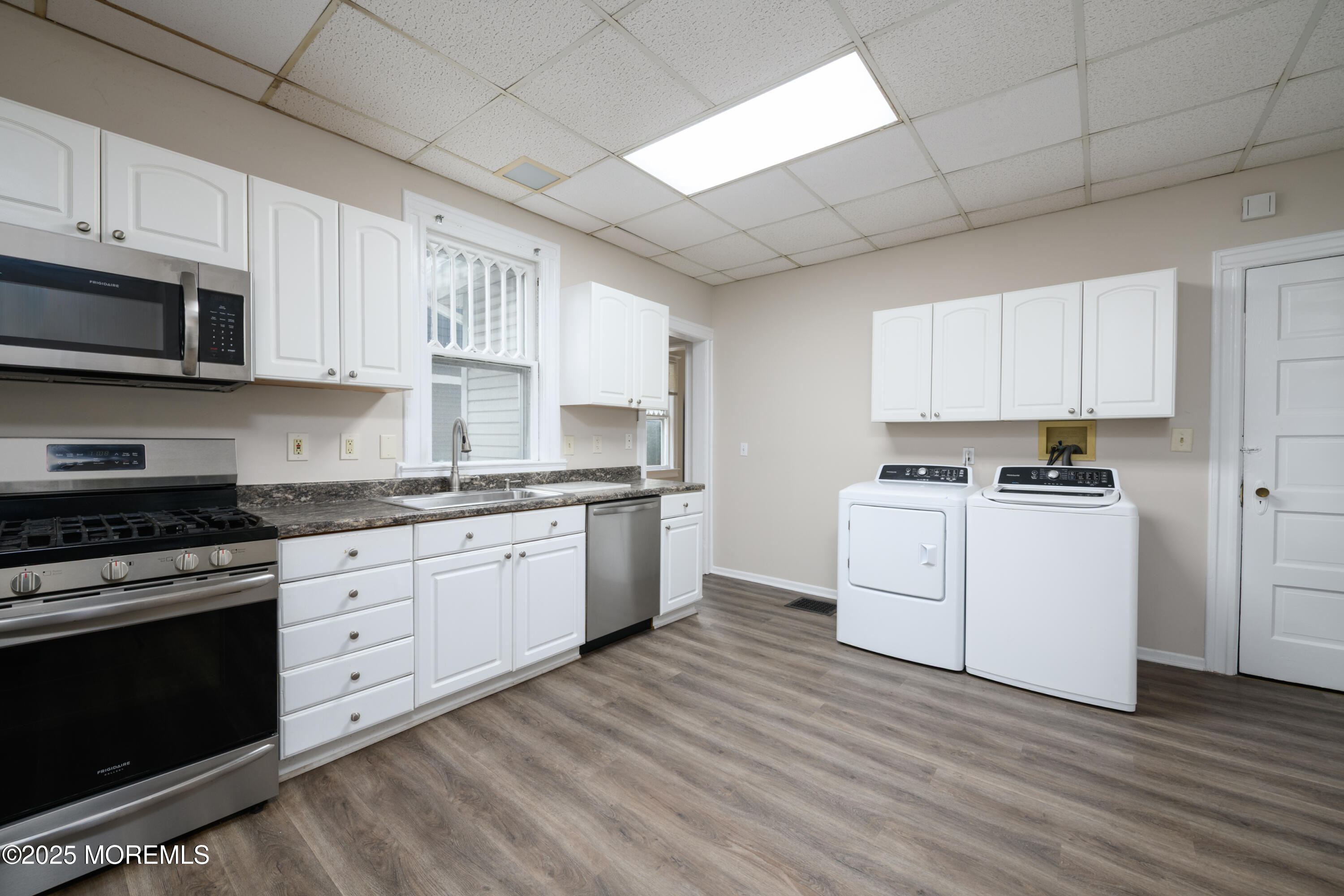 64 Harding Road Red Bank, NJ 07701 - Photo 12 of 23 a kitchen with granite countertop white cabinets and white appliances