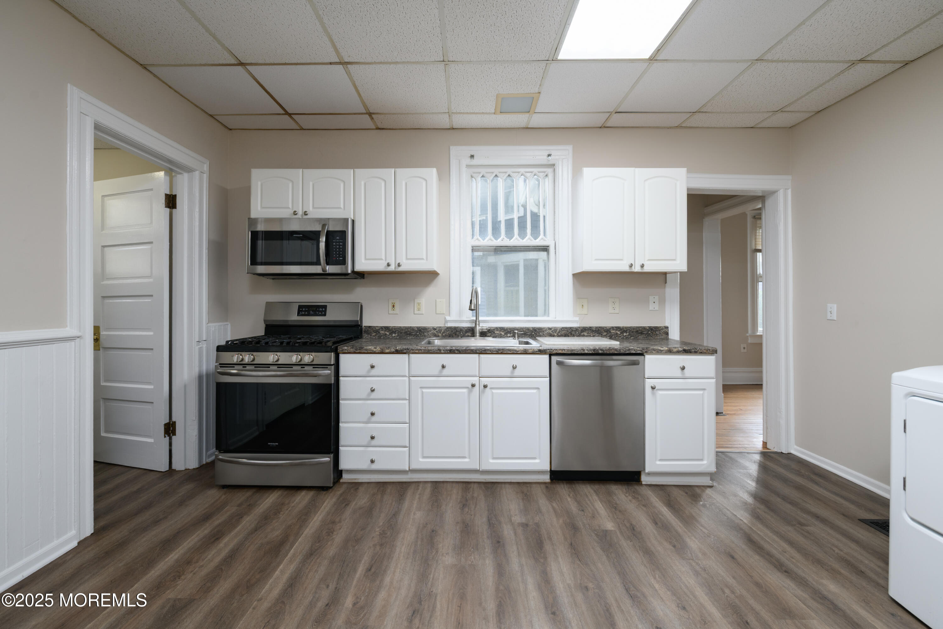 64 Harding Road Red Bank, NJ 07701 - Photo 13 of 23 a kitchen with a stove a sink and a refrigerator