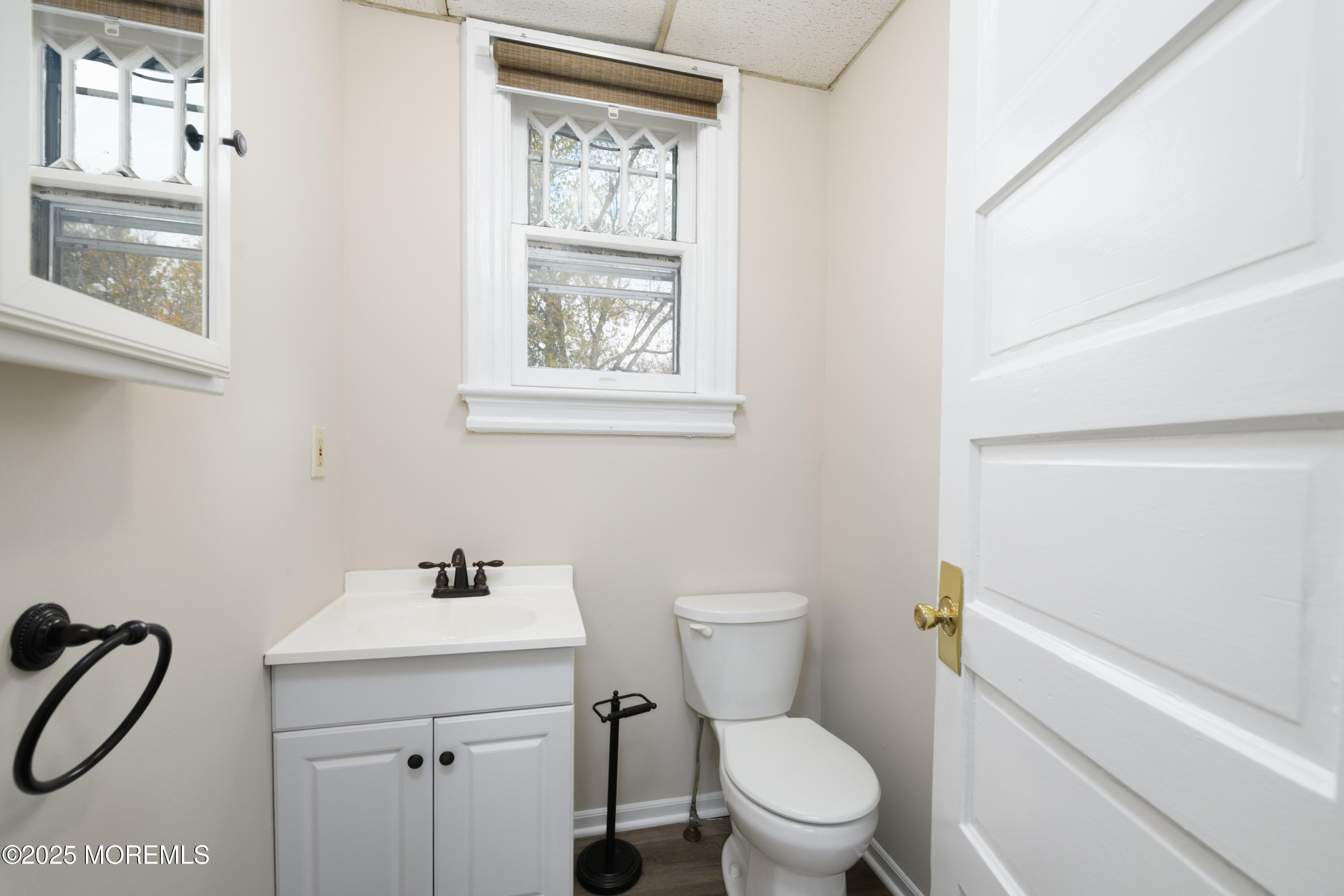 64 Harding Road Red Bank, NJ 07701 - Photo 15 of 23 a white toilet sitting next to a bathroom sink