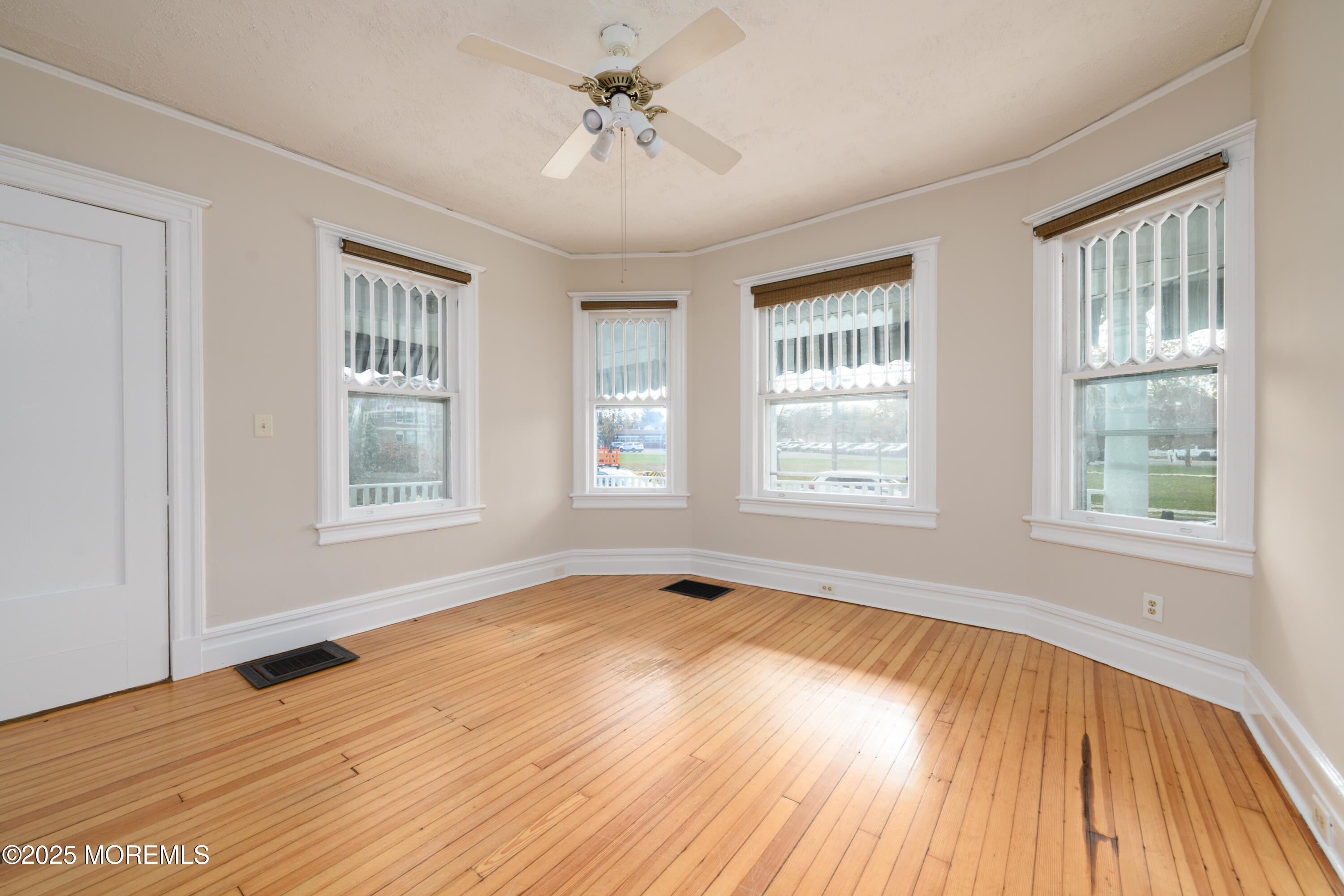 64 Harding Road Red Bank, NJ 07701 - Photo 9 of 23 a view of an empty room with wooden floor and a window