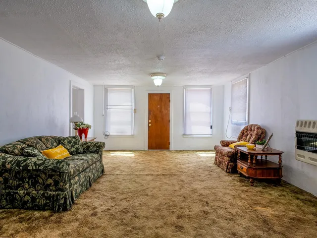 a bedroom with bed and window