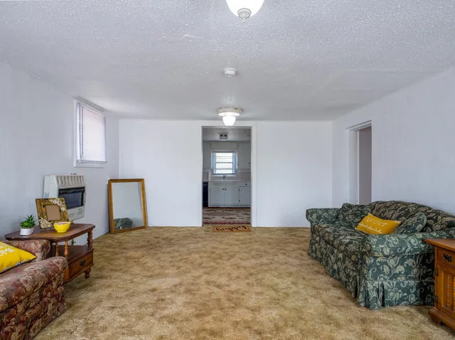 a kitchen with stainless steel appliances granite countertop a refrigerator sink and stove