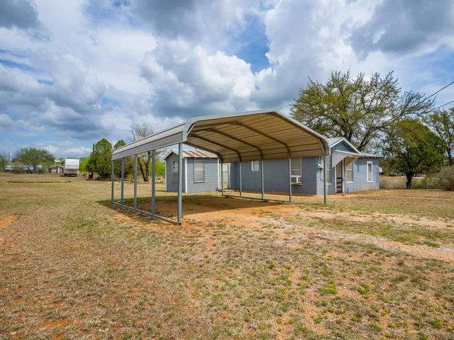 a house with trees in front of it