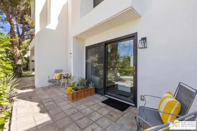 a kitchen with a refrigerator and a sink