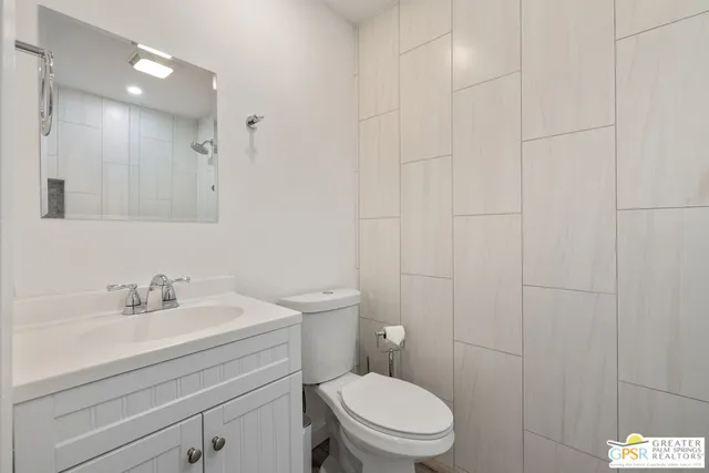 a swimming pool with outdoor seating and yard